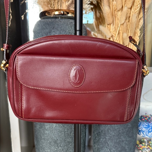Cartier Handbags - Cartier Vintage Burgundy Leather crossbody bag with Gold Details W/ COA